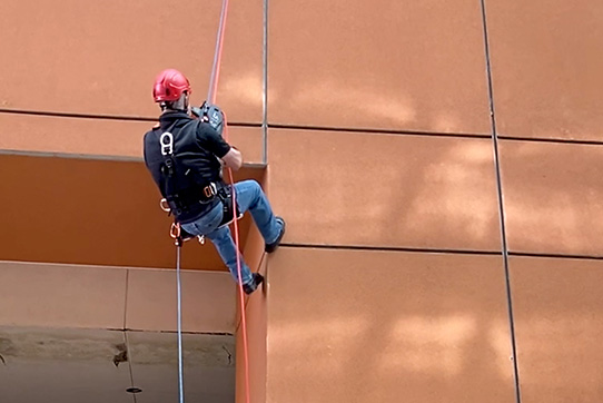 Worker in hoist